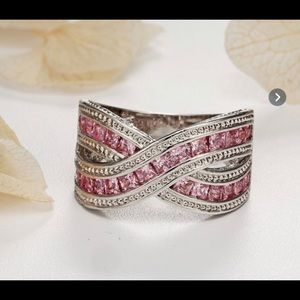 Size 6 fashion ring. Silver with pink stones. New in package